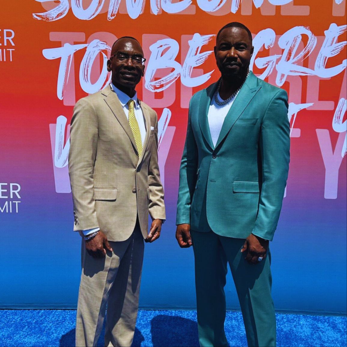 Dr. Michael Thompson standing next to a man, smiling at the camera.