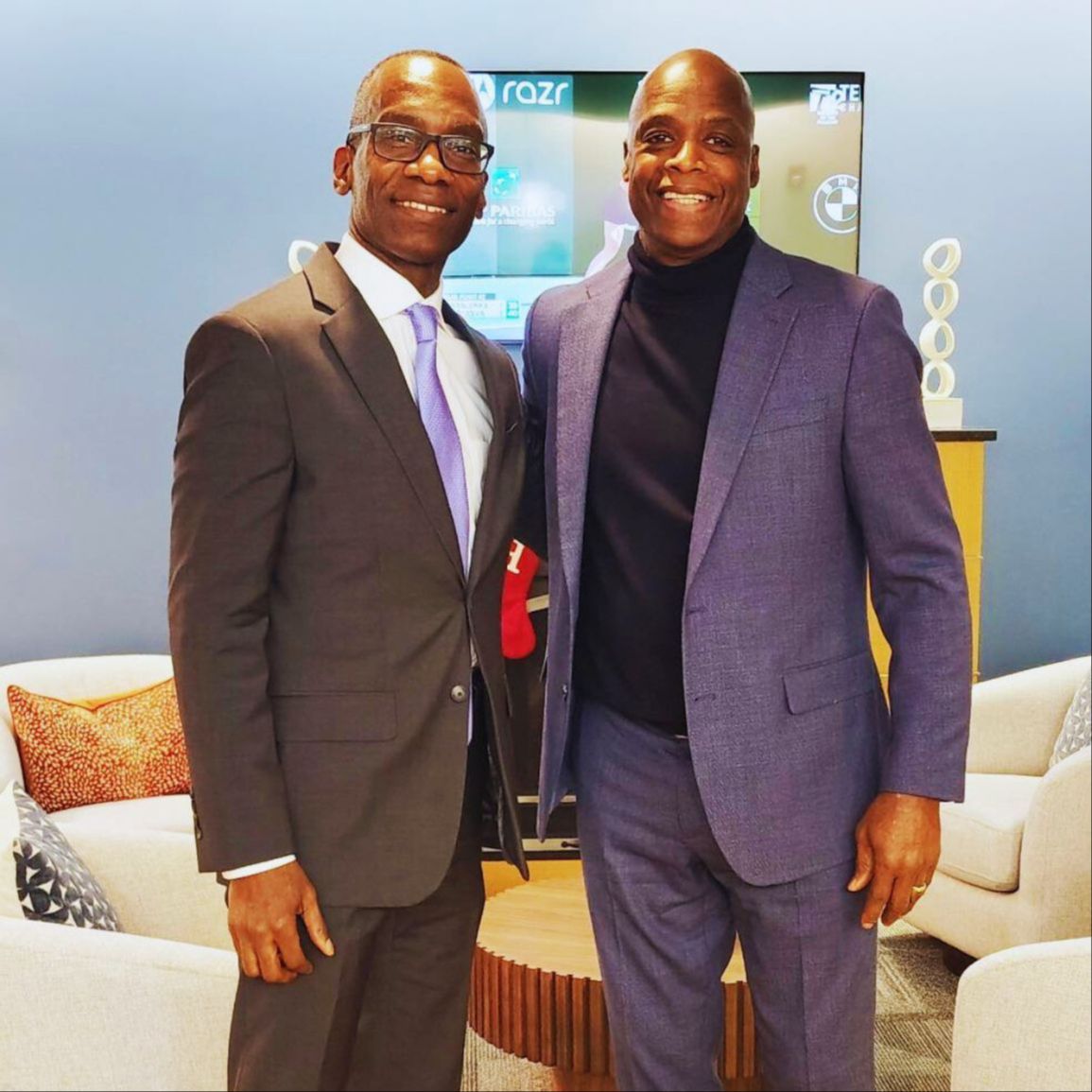 Dr. Michael Thompson standing next to a man, smiling at the camera.